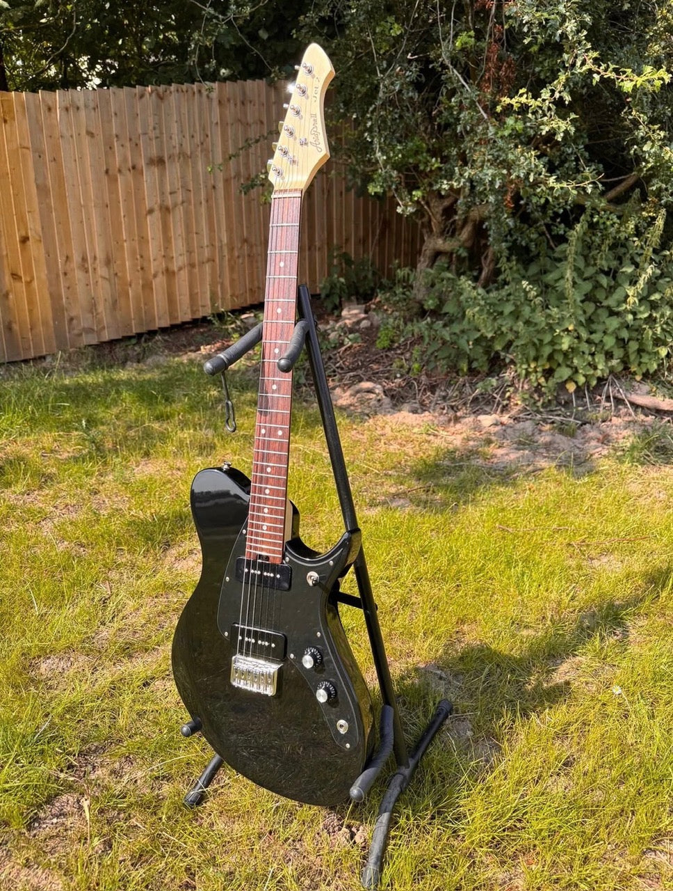 Kassie - black solid-body electric guitar